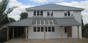 Residential property refurbishment in Bognor Regis with roof completed in grey-green Brazilian slates by Kingsley Roofing.