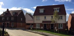 view of several residential propertieas re-roofed by kingsley roofing as part of a larger project for a main contractor