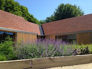 BPitched, tiled roofs completed by Kingsley Roofing at the open air museum in Chichester.