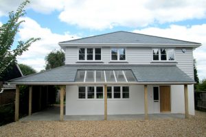 Residential property refurbishment in Bognor Regis with roof completed in grey-green Brazilian slates by Kingsley Roofing.