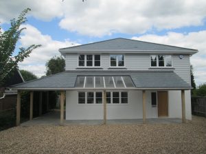 Residential property refurbishment in Bognor Regis with roof completed in grey-green Brazilian slates by Kingsley Roofing.