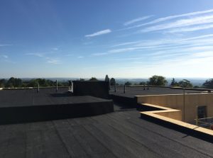 Kingsley Roofing completed a dark grey felt roof on this smart apartment block in Haywards Heath