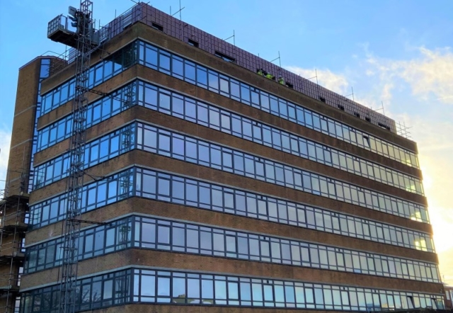 Copper-coloured cladding on a block of flats